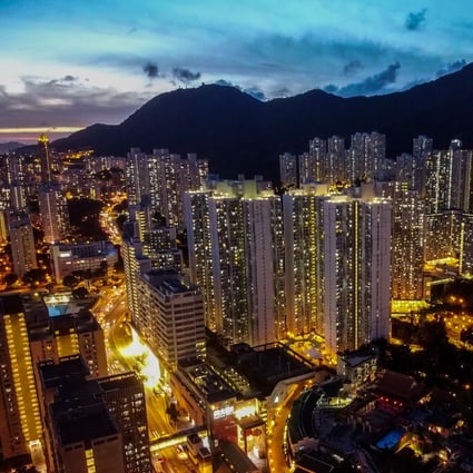 Hong Kong’s residential buildings gleam in the twilight in Wong Tai Sin on Kowloon. Hong Kong has for years held the dubious distinction of being world’s least affordable housing market. Photo: Sun Yeung