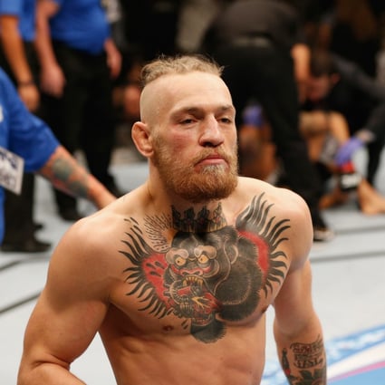 Conor McGregor walks off after his first-round TKO win over Dustin Poirier in their featherweight fight at UFC 178. Photo: Josh Hedges/Zuffa LLC via Getty Images