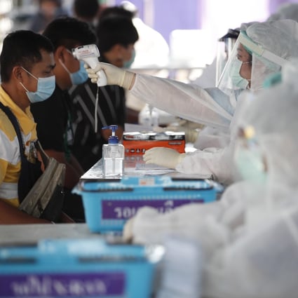 Residents of Nonthaburi province undergo Covid-19 testing on Monday amid a resurgence of the virus. Photo: EPA-EFE