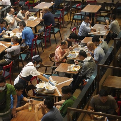 Customers have their lunch in Admiralty, Hong Kong, despite coronavirus restrictions. Photo: Winson Wong