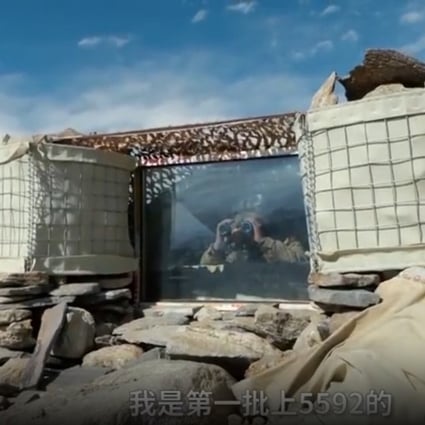 A PLA soldier keeps watch from the improved 5592 observation post. Photo: CCTV