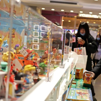 Consumers browse at Chinese toymaker Pop Mart’s outlet inside a shopping centre in Beijing. Photo: Reuters
