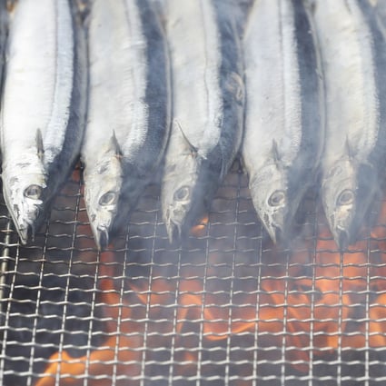 Saury on the grill at a festival for the fish in Tokyo. Photo: Kyodo