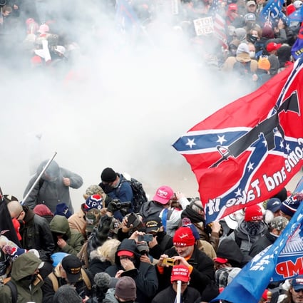 Tear gas is released into a crowd of protesters during clashes with Capitol police. Photo: Reuters