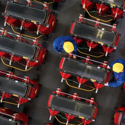 China will grow by 7.9 per cent this year, the IMF forecasts, down from its previous prediction of 8.2 per cent growth made in October. Photo: AFP