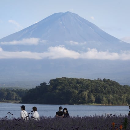 Mount Fuji looms over Lake Kawaguchi, about 100km west of Tokyo. Photo: EPA-EFE