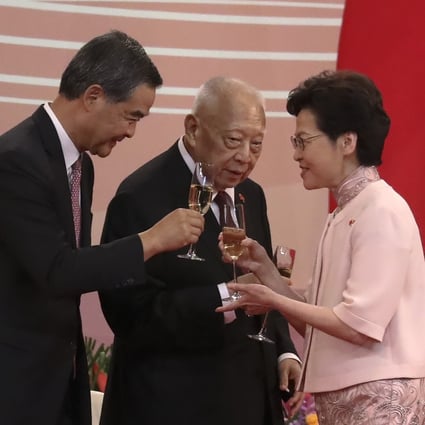 Chief Executive Carrie Lam (right) clinks her glass with former chief executives Leung Chun-ying (left) and Tung Chee-hwa at the reception for the 23rd anniversary of the establishment of the Hong Kong Special Administrative Region, at the Convention and Exhibition Centre in Wan Chai on July 1, 2020. Photo: K.Y. Cheng