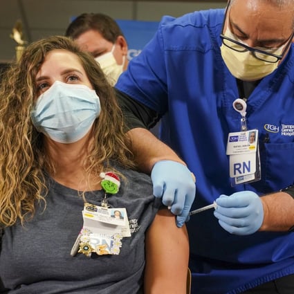Nurse Vanessa Arroyo receives a Covid-19 vaccine at Tampa General Hospital in Florida on December 14. Photo: TNS