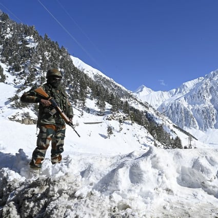 An Indian army soldier stands guard along the frontier with China. Photo: AFP