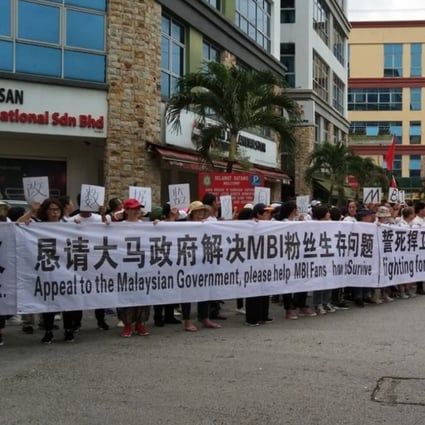 Scores of Chinese nationals demonstrate outside their embassy in Malaysia in 2019 claiming they lost their life savings to Teow’s MBI group. Photo: Irene Andy / Facebook