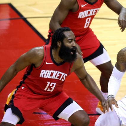 LeBron James, of the Los Angeles Lakers, battles with James Harden, of the Houston Rockets, in an NBA game. Photo: AFP