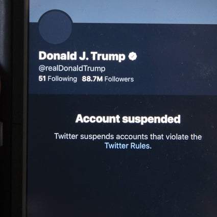 A mobile phone displays the suspended status of the Twitter account of US President Donald Trump. Twitter made the decision to ban the account after Trump incited a mob of his supporters to riot on the US Capitol in an attempt to stop Congress from counting the electoral college votes, causing chaos and several fatalities. Photo: EPA-EFE