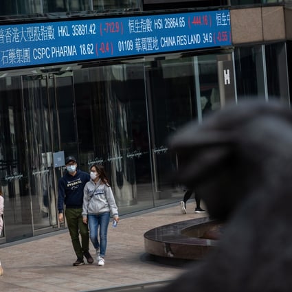 Pedestrians walk past Exchange Square in Central, Hong Kong. Hong Kong stock investors have never been so bullish in greeting a new year since 2011. Photo: EPA-EFE