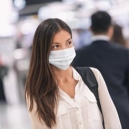 The WHO recommends disposing of face masks after one use, but what are the risks of reusing them? Photo: Shutterstock