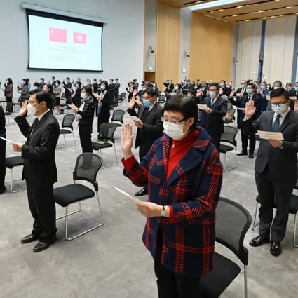 Hong Kong civil servants take their oath of allegiance to the Hong Kong SAR and the People’s Republic of China, on December 18. Photo: Handout