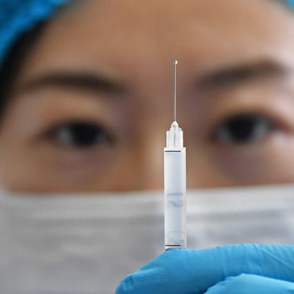 A medical worker prepares a shot of the Sinovac vaccine against Covid-19 at a community health station in Yantai, eastern Shandong province, on January 5. China plans to immunise 50 million people in certain high-risk groups before the Lunar New Year holiday in February, according to reports. Photo: EPA
