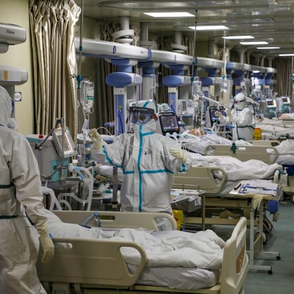 Medical workers attend to Covid-19 patients at a hospital in Wuhan in February. Beijing has for months defended its initial response to the virus. Photo: Reuters