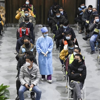 Coronavirus vaccine recipients in Beijing wait for 30 minutes to see if they have any adverse reactions. Photo: Kyodo