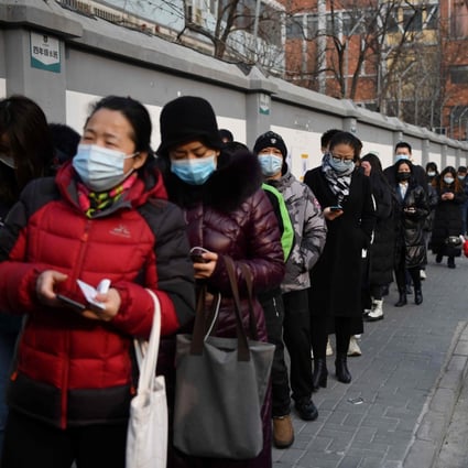 People line up to be tested for the coronavirus in Beijing on Friday. Photo: AFP