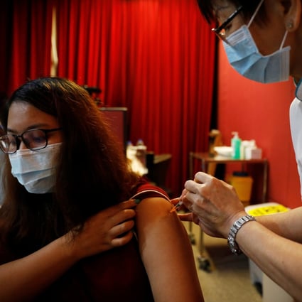 A health care worker is vaccinated at Gleneagles Hospital in Singapore on January 19, 2021. Photo: Reuters