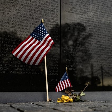 American flags at the base of the Vietnam Veterans Memorial Wall in Washington, DC. Photo: AFP