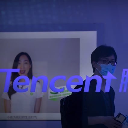 A visitor walks past a logo for Chinese technology firm Tencent at their display at the China International Fair for Trade in Services (CIFTIS) in Beijing on September 5, 2020. Photo: AP