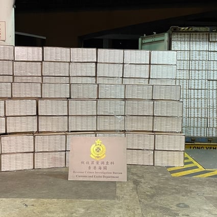 Customs officials display a haul of illicit cigarettes worth about HK$29 million seized on Sunday. Photo: Handout