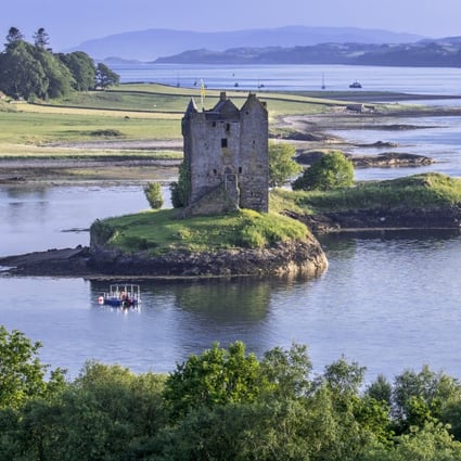 Castle Stalker in Loch Laich, Argyll, Scotland. VisitScotland has become the first national tourist board to declare a climate emergency, by joining the global Tourism Declares initiative. Photo: Getty Images