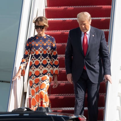 Melania Trump smiles as she descends from Air Force One in Florida with her husband, outgoing US president Donald Trump, on January 20. Mid-air, she swapped a sober, all-black outfit for a boho-chic Gucci kaftan dress, typical of her preference for high-end European fashion. Photo: Noam Galai/Getty Images/AFP