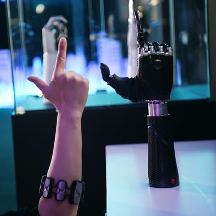 An employee demonstrates a wearable AI-powered bionic hand at the JD Global Technology Discovery Conference in Beijing, Nov. 25, 2020. China must mobilise the nation’s private businesses to reduce reliance on foreign technologies, says a top policy adviser. Photo: Xinhua