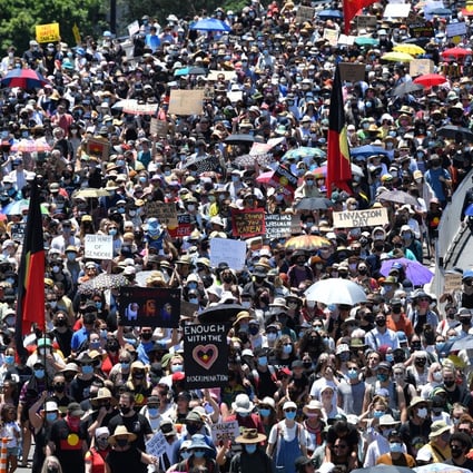Protesters take part in an ‘Invasion Day’ rally in Brisbane on Tuesday. Photo: AFP