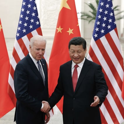 Xi Jinping shakes hands with Joe Biden in 2013. Photo: AP