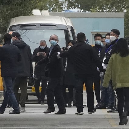 Members of the World Health Organization team depart from the Wuhan Jinyintan Hospital. Photo: AP