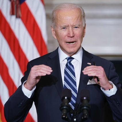 US President Joe Biden speaks on climate change and job creation before signing executive orders in the State Dining Room of the White House on January 27. Photo: AFP