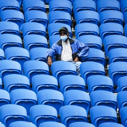 A lone spectator watches action in the Yarra Valley Classic in Melbourne Park on Monday. At the Australian Open, starting next Monday, up to 30,000 fans will be allowed in each day. Photo: EPA-EFE
