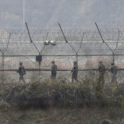 South Korean army soldiers patrol a fence in Paju, South Korea, near the border with North Korea. File photo: AP