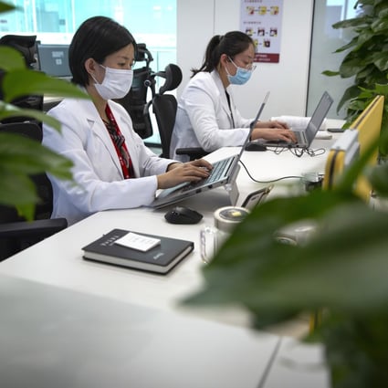 JD Health doctors use computers to chat online as they consult with patients at the JD.com headquarters in Beijing on Friday, March 27, 2020. Photo: AP