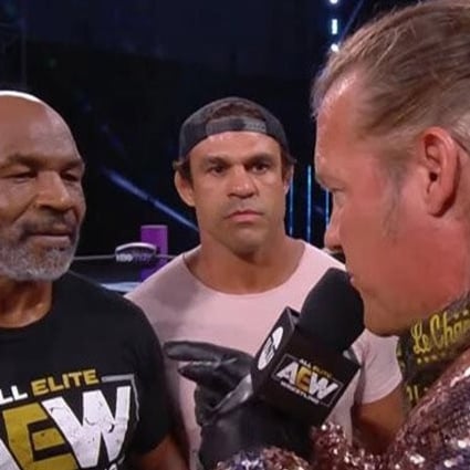 Mike Tyson, backed up by Vitor Belfort (centre), confronts Chris Jericho (right) on AEW Dynamite. Photo: AEW