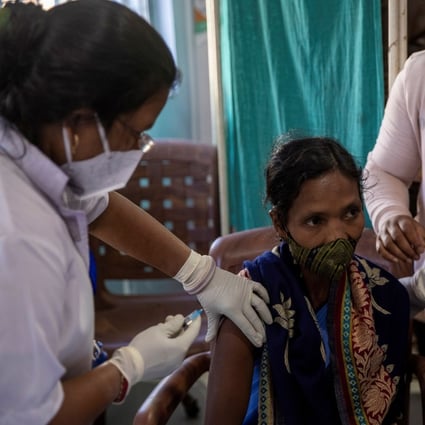 A health worker receives a coronavirus vaccine developed by Oxford/AstraZeneca in India last month. Photo: Reuters