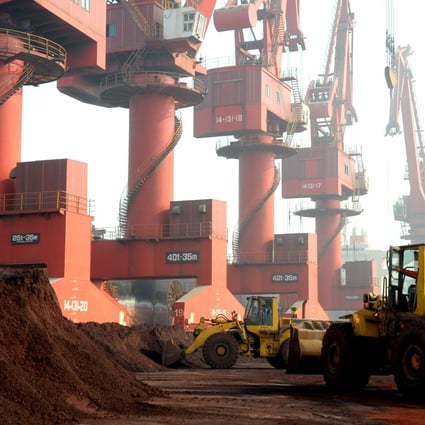 Workers transport soil containing rare earth elements for export at a port in Lianyungang in eastern Jiangsu province. Photo: Reuters
