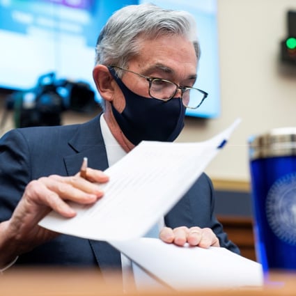 Federal Reserve chair Jerome Powell prepares for a House Financial Services Committee hearing in Washington on December 2 last year. The Fed’s ultra-loose monetary policy settings remain the order of the day even though they may have undesired side-effects. Photo: Reuters