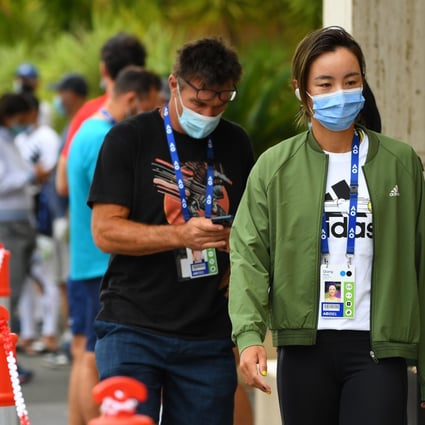 Tennis player Wang Qiang waits in line for a Covid-19 test at the View Hotel in Melbourne days before the Australian Open is expected to start. Photo: AAP Image/James Ross NO ARCHIVING