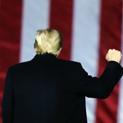Then US President Donald Trump gestures at a campaign rally in Georgia in January. Photo: AP