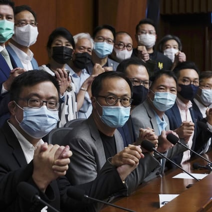 Hong Kong’s pro-democracy legislators pose for a picture before a press conference at Legco in Hong Kong on November 9, ahead of their mass resignation. Photo: AP
