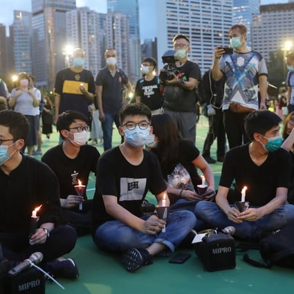 Joshua Wong (centre) takes part in a June 4 vigil in Victoria Park. Photo: Sam Tsang