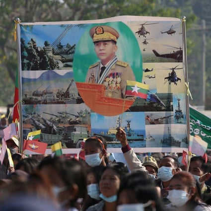 Supporters of Myanmar’s military carry a portrait of junta leader General Min Aung Hlaing as they celebrate the coup in Naypyitaw. Photo: Reuters