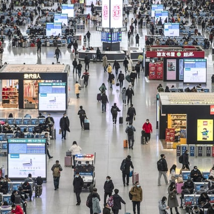 Travelers at the departure hall of the Hongqiao Railway Station in Shanghai ahead at the start of this year’s Lunar New Year travel rush. Photo: Bloomberg