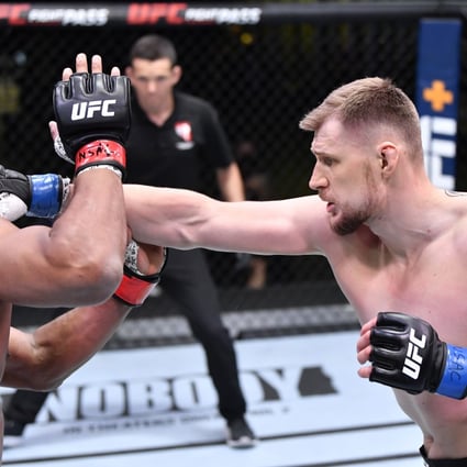 Russian Alexander Volkov punches Alistair Overeem in their heavyweight fight during the UFC Fight Night event at UFC APEX in Las Vegas. Photo: Chris Unger/Zuffa LLC
