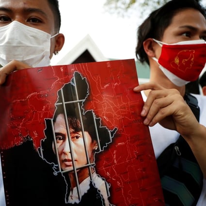 Protesters in Myanmar with a picture of Aung San Suu Kyi after the military seized power in a coup. Photo: Reuters