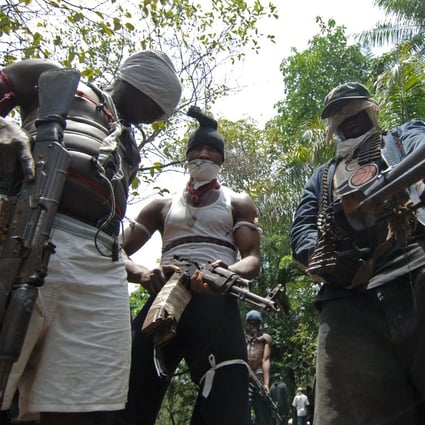 Masked gunmen pictured in Nigeria’s oil-rich Rivers State in 2007. Kidnapping for ransom used to be common in Nigeria’s oil-producing south but has lately spread to the other parts of the country. Photo: AFP